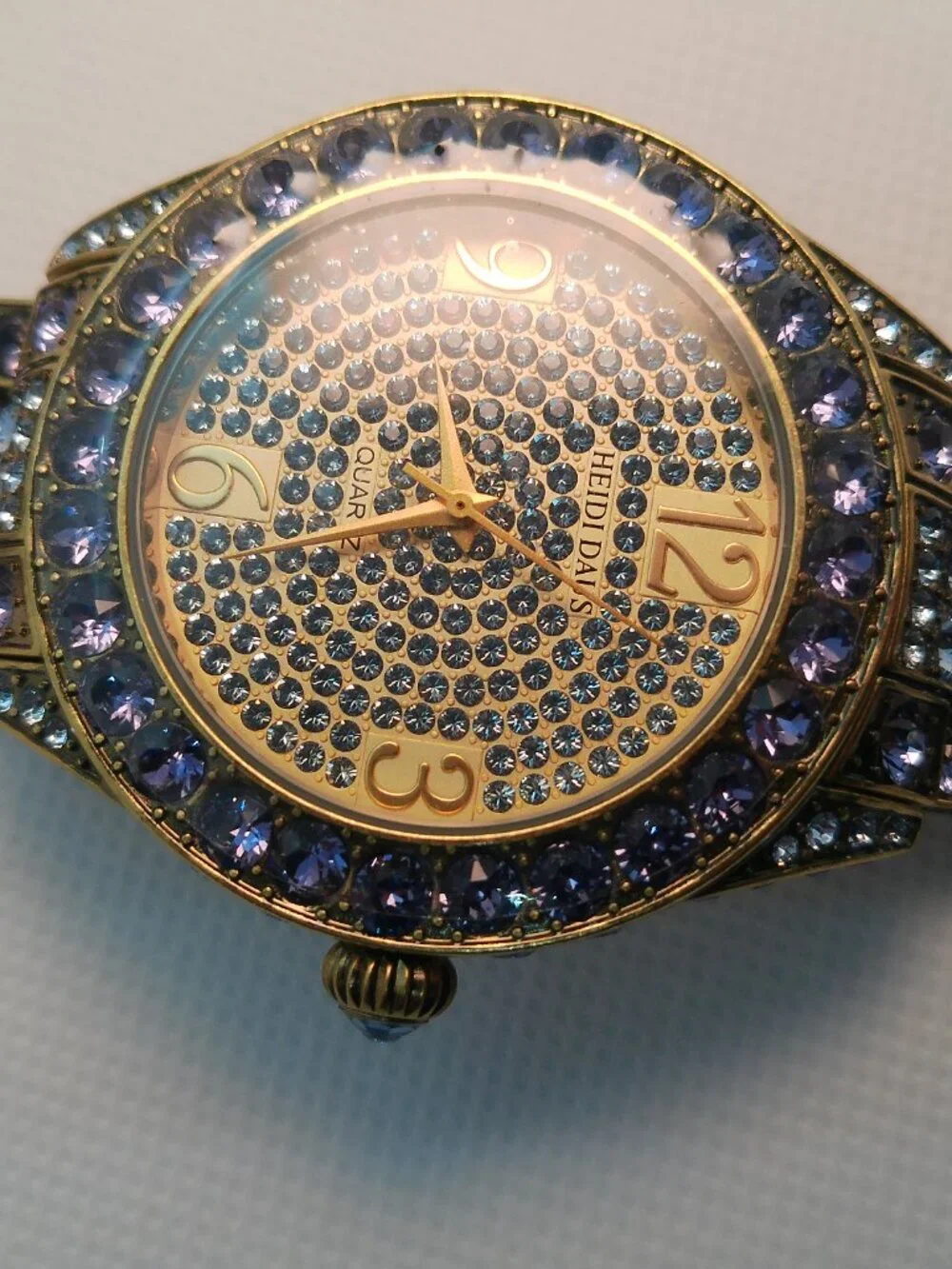 Heidi Daus quartz fashion watch bronze-tone covered with lavender-purple crystal